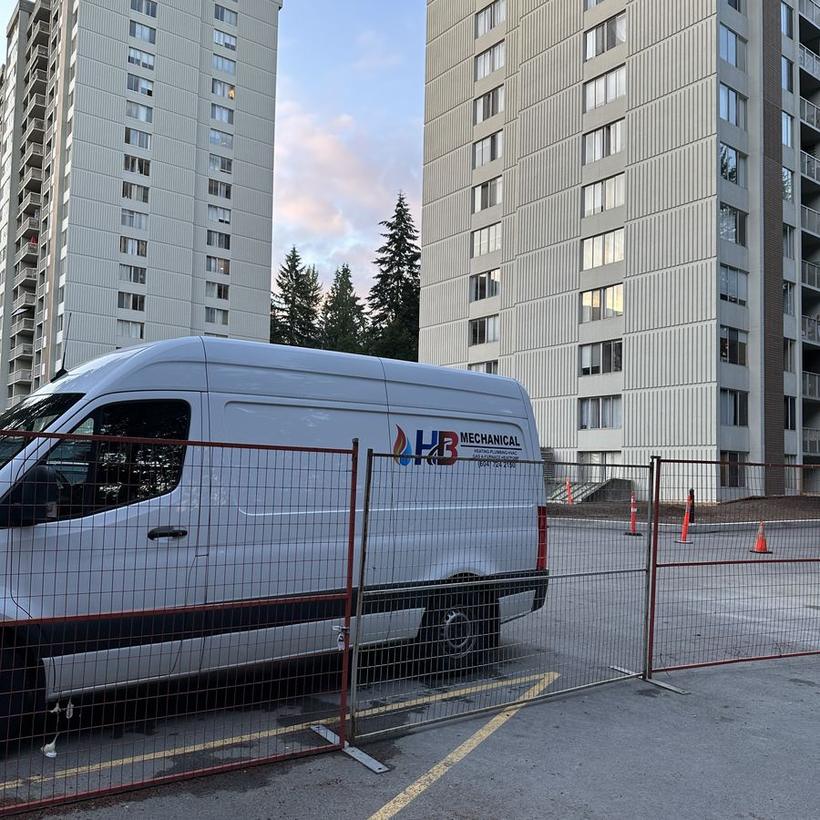 HB Mechanical service van on site at a North Shore high-rise