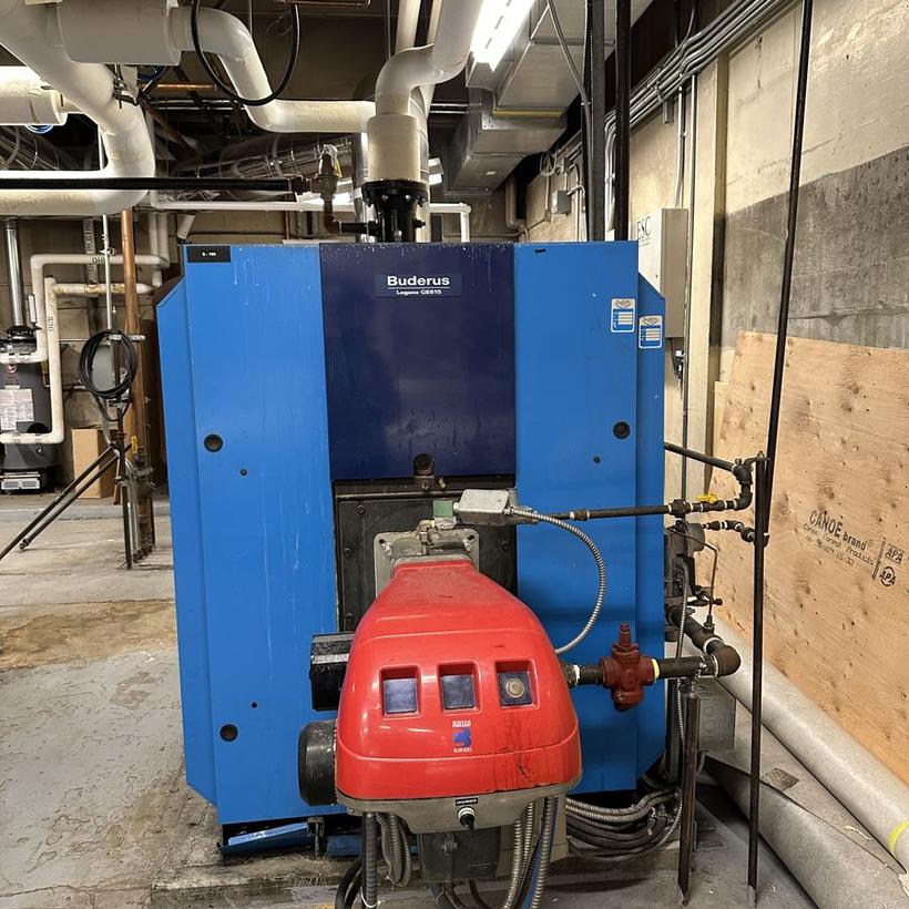 Buderus Logano GE615 boiler with Riello burner in a commercial mechanical room